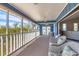 Spacious screened porch with comfortable seating and picturesque views at 331 Bocilla Dr, Placida, FL 33946