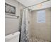 Updated walk-in shower featuring decorative tile, rainfall shower head, and modern fixtures at 331 Bocilla Dr, Placida, FL 33946