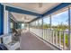 Inviting sunroom featuring comfortable wicker seating, ceiling fans, and serene outdoor views at 331 Bocilla Dr, Placida, FL 33946