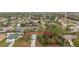 Aerial view of a property highlighting the landscaping and spacious layout within a residential neighborhood at 332 Comstock St, Port Charlotte, FL 33954