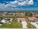 Aerial view of property showing the home, landscaping, and surrounding neighborhood at 35 Sportsman Pl, Rotonda West, FL 33947