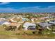 Aerial view of single story home with a circle around it showing proximity to a golf course at 36 Bunker Cir, Rotonda West, FL 33947