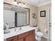 Bathroom with single vanity, toilet and shower at 39 Tournament Rd, Rotonda West, FL 33947