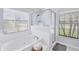 Relaxing bathroom with soaking tub and walk-in shower at 39 Tournament Rd, Rotonda West, FL 33947