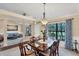Formal dining room with a glass-top table and six chairs at 39 Tournament Rd, Rotonda West, FL 33947