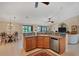 Island kitchen with stainless steel appliances and ample counter space at 39 Tournament Rd, Rotonda West, FL 33947
