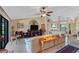 Living room with sectional sofa, large TV, and lots of natural light at 39 Tournament Rd, Rotonda West, FL 33947