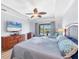 Relaxing main bedroom with large TV and pool view at 39 Tournament Rd, Rotonda West, FL 33947