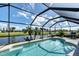 Screened-in pool with a beautiful canal view at 39 Tournament Rd, Rotonda West, FL 33947