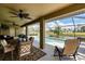 Large screened-in pool with canal view and patio furniture at 39 Tournament Rd, Rotonda West, FL 33947