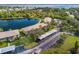 Aerial view highlighting lakefront condos with covered parking, surrounded by lush greenery and serene waters at 4072 Oakview Dr # C8, Punta Gorda, FL 33980