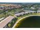 Aerial view showcasing community's waterfront location, lush landscaping, and convenient parking at 4072 Oakview Dr # C8, Punta Gorda, FL 33980