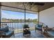 Relax on this screened lanai, with its ceiling fan, outdoor seating, and picturesque water views at 4072 Oakview Dr # C8, Punta Gorda, FL 33980