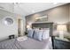 Bedroom with cozy gray decor, ceiling fan, and a bathroom doorway visible at 4072 Oakview Dr # C8, Punta Gorda, FL 33980