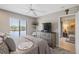 Bedroom with a large window view, tv on dresser, ceiling fan, and calming colors at 4072 Oakview Dr # C8, Punta Gorda, FL 33980
