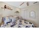 Bedroom with a comfortable bed, decor shelving, and a sliding closet at 4072 Oakview Dr # C8, Punta Gorda, FL 33980