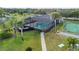 Aerial shot of the screened community pool, tennis court, and lounge area at 4072 Oakview Dr # C8, Punta Gorda, FL 33980