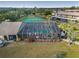 Aerial view of the community pool, tennis court, and lush greenery at 4072 Oakview Dr # C8, Punta Gorda, FL 33980