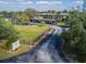 Welcoming gated community entrance with manicured landscaping, mature trees, and covered parking at 4072 Oakview Dr # C8, Punta Gorda, FL 33980