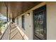 Hallway with multiple doors and windows, provides exterior access to individual condominium units at 4072 Oakview Dr # C8, Punta Gorda, FL 33980