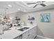 Bright kitchen island with stainless steel faucet and appliances with open view to the living spaces at 4072 Oakview Dr # C8, Punta Gorda, FL 33980