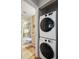 Laundry area with stackable washer and dryer adjacent to the bathroom at 4072 Oakview Dr # C8, Punta Gorda, FL 33980