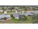 Aerial view of house and surrounding neighborhood at 5 Broadmoor Ln, Rotonda West, FL 33947