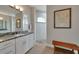 Spa-like bathroom with a large walk-in shower and granite vanity at 5 Broadmoor Ln, Rotonda West, FL 33947
