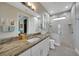 Bathroom with walk-in shower and granite vanity at 5 Broadmoor Ln, Rotonda West, FL 33947