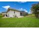 House exterior showcasing side yard and pool at 5 Broadmoor Ln, Rotonda West, FL 33947