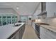 Bright kitchen boasts stainless steel appliances and an oversized island at 5 Broadmoor Ln, Rotonda West, FL 33947