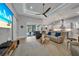 Open living space featuring a comfortable seating area, kitchen, and access to backyard pool at 5 Broadmoor Ln, Rotonda West, FL 33947