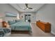 Spacious main bedroom with a king-size bed and access to the pool at 5 Broadmoor Ln, Rotonda West, FL 33947