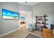 Home office features a large TV, comfortable seating, and a bookshelf at 5 Broadmoor Ln, Rotonda West, FL 33947