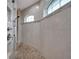 Large walk-in shower with tile surround and multiple shower heads at 5 Broadmoor Ln, Rotonda West, FL 33947