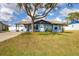 Newly painted light blue home with a large front yard at 530 Lakehurst Nw Ave, Port Charlotte, FL 33952