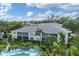 Aerial view of condo community with pool and lush landscaping at 5725 Greenwood Ave # 8101, North Port, FL 34287