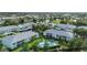 Condo community overview featuring multiple buildings and a pool at 5725 Greenwood Ave # 8101, North Port, FL 34287