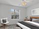 Guest bedroom with a queen bed and window at 5725 Greenwood Ave # 8101, North Port, FL 34287