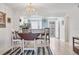 Dining area with round table and chairs, adjacent to kitchen at 5725 Greenwood Ave # 8101, North Port, FL 34287