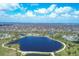 An aerial view of a planned community and a large lake on a sunny day at 604 Boundary Blvd, Rotonda West, FL 33947