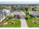 Aerial view of a well-maintained property with lush landscaping and mature trees at 604 Boundary Blvd, Rotonda West, FL 33947