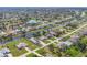 Expansive aerial view of a waterfront community with lush landscaping, canals, and single-Gathering homes at 604 Boundary Blvd, Rotonda West, FL 33947