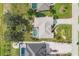 An aerial view shows the property with a pool and a well-manicured lawn at 604 Boundary Blvd, Rotonda West, FL 33947