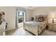 Comfortable bedroom with a large window providing lots of natural light and a nice view at 604 Boundary Blvd, Rotonda West, FL 33947