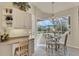 Bright breakfast nook featuring a view to the pool, a chandelier, and desk area at 604 Boundary Blvd, Rotonda West, FL 33947