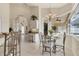Well-lit breakfast nook featuring a chandelier, desk area, and seamless view to other living spaces at 604 Boundary Blvd, Rotonda West, FL 33947