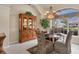Comfortable dining area featuring a decorative chandelier, large window for natural light, and elegant furnishings at 604 Boundary Blvd, Rotonda West, FL 33947