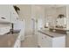 Spacious kitchen with white cabinetry, modern appliances, and tile flooring at 604 Boundary Blvd, Rotonda West, FL 33947