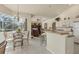 Open-concept kitchen and dining area with tile floors and plenty of counter space, great for gatherings at 604 Boundary Blvd, Rotonda West, FL 33947